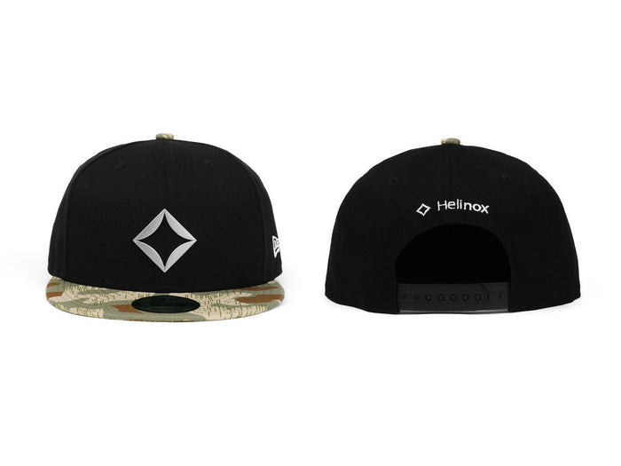 Front and back view of a black Helinox snapback cap with a camouflage brim
