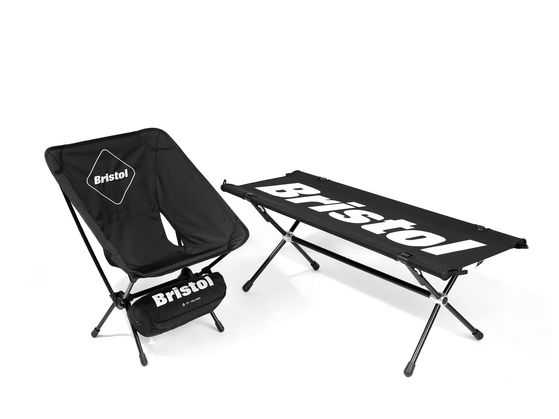 Black portable Helinox camping chair and cot featuring bold white Bristol logos