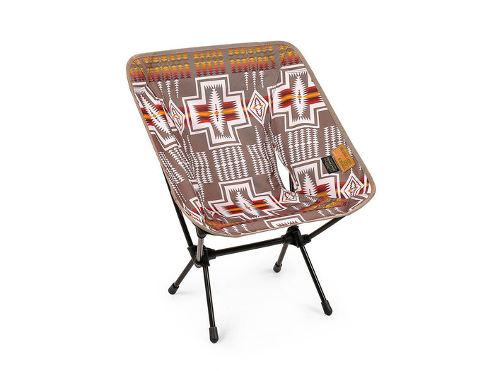 Helinox x Pendleton camp chair with brown Southwestern geometric pattern on a white background