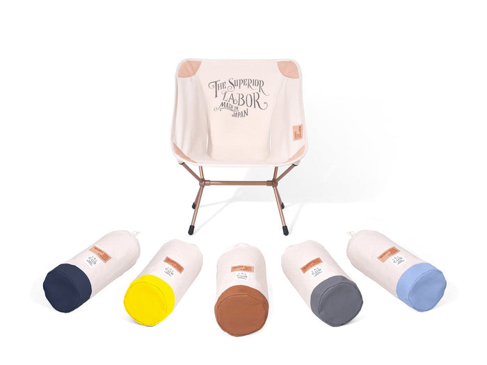 Helinox x The Superior Labor cream camp chair with five colorful carry bags on a white background