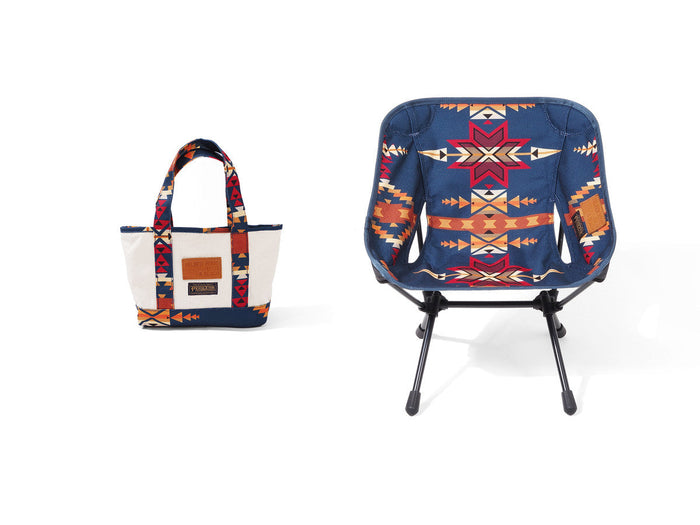 Helinox x Pendleton blue camp chair with matching canvas tote bag on a white background