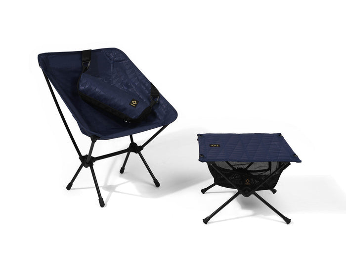 A Helinox x Pilgrim Surf + Supply camp chair and table.