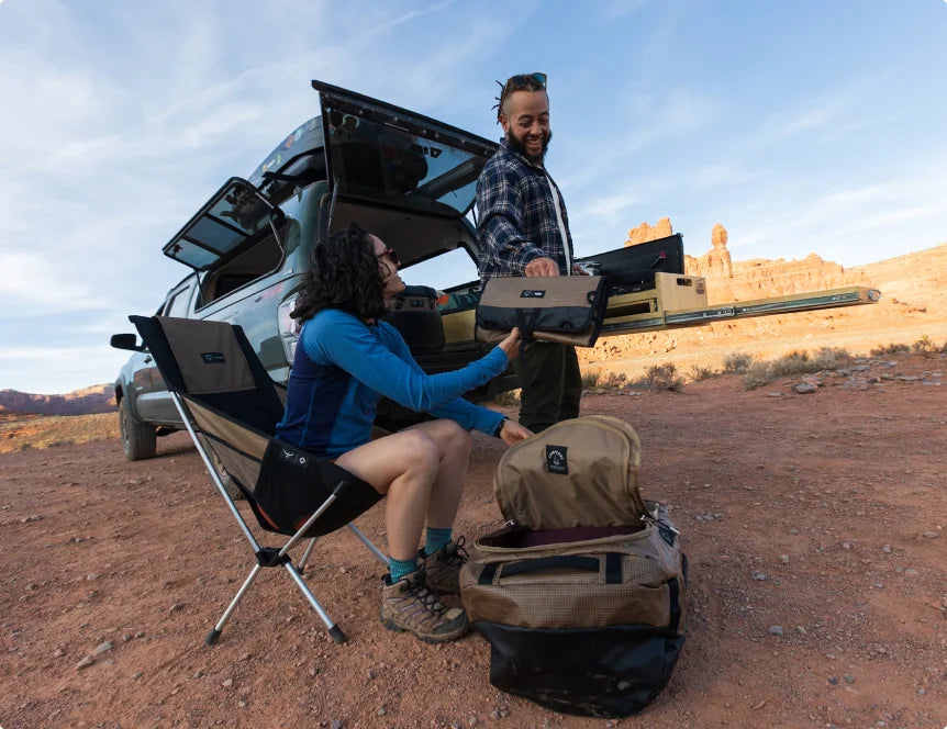 Camper setting up gear at the truck
